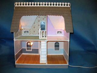 The house all lit up from the back.