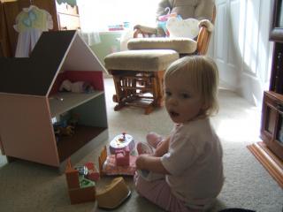 katie at 20 months playing with the dollhouse I made her