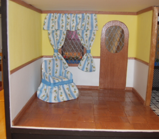 M.E. Living Room w/ curtains and chair